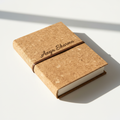 Personalized cork journal with engraved cover on white background